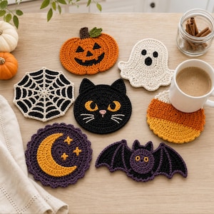 May include: A set of six crocheted coasters featuring Halloween-themed designs including an orange pumpkin, a white ghost, a black spiderweb, a black cat face, a candy corn triangle, a purple moon with stars, and a purple bat with yellow eyes.