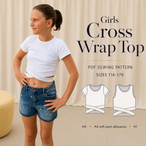 May include: A white ribbed short-sleeve crop top with a cross-wrap front design. The image includes text reading Girls Cross Wrap Top, PDF Sewing Pattern, sizes 116-170, and technical line drawings of the top with A4 and A1 paper format options.