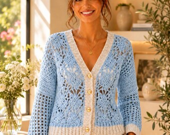 May include: A light blue and cream crochet cardigan featuring a V-neckline, long sleeves with a grid-like pattern, and a front button closure with four gold-toned buttons. The garment has a cream-colored ribbed trim along the neckline, hem, and cuffs.