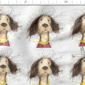 Könnte beinhalten: Ein weißer Stoff mit einer wiederkehrenden Illustration eines braun-weißen Hundes mit struppigem Fell, einem gelben Halsband und einem roten Oberteil. Eine Sicherheitsnadel aus Metall steckt im Stoff, daneben eine Skala von 38 cm und 15 Zoll.