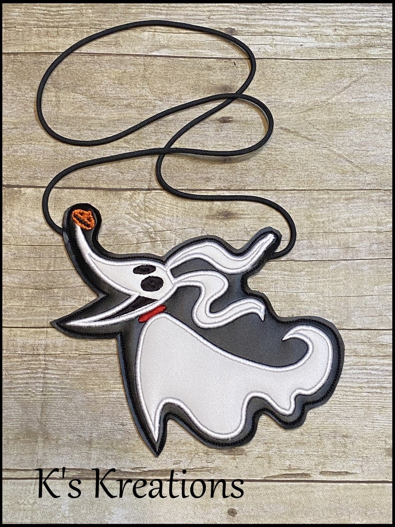May include: A black and white Zero character lanyard with a black cord. The Zero character has a white body, black outline, and a small orange pumpkin on its head. The text "K's Kreations" is at the bottom.