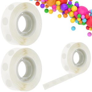 May include: Three rolls of clear adhesive balloon glue dots, with one roll partially unspooled to show the individual circular adhesive stickers. The background features a colorful arrangement of various sized balloons in shades of red, orange, yellow, green, blue, purple, and pink.