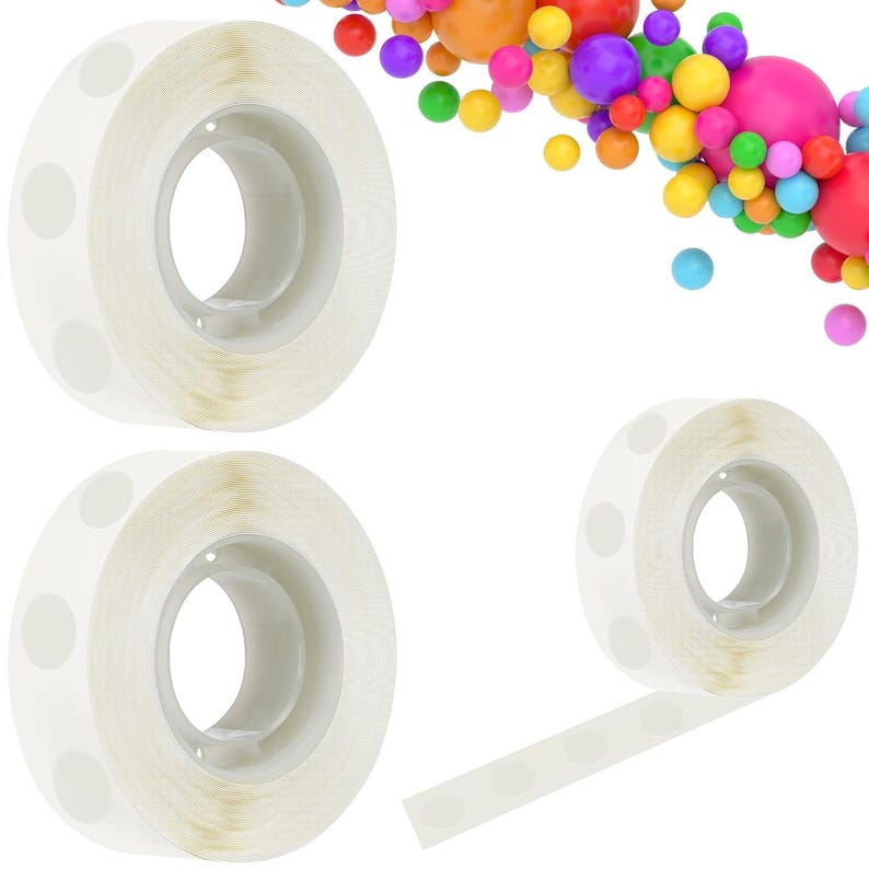 May include: Three rolls of clear adhesive balloon glue dots, with one roll partially unspooled to show the individual circular adhesive stickers. The background features a colorful arrangement of various sized balloons in shades of red, orange, yellow, green, blue, purple, and pink.