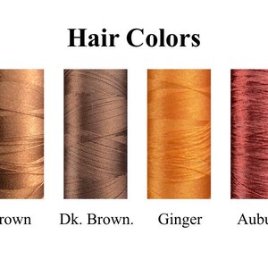 May include: A chart showing different hair colors with the names "Blonde", "Dk. Blonde", "Brown", "Dk. Brown.", "Ginger", "Auburn", "Black", and "Gray" written below each color.