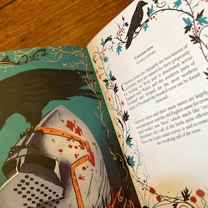 May include: A black crow perched on a medieval helmet with red blood splatters. The crow is depicted in a detailed illustration with a teal background and ornate floral borders. The text "Carrion crow" and "Corvus corone" is visible in the image.
