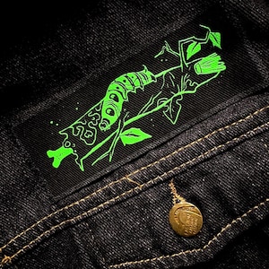 May include: A set of three ceramic nesting bowls in shades of blue, green, and white. The bowls feature a speckled glaze and a simple, modern design. The largest bowl measures approximately 8 inches in diameter.