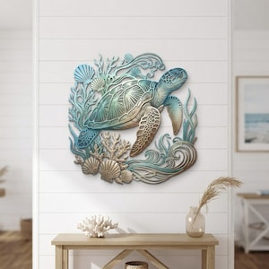 May include: A multi-layered wall art piece featuring a sea turtle swimming among coral and seashells. The design uses a gradient color palette of teal, blue, and metallic gold, creating a dimensional effect with intricate cut-out details.