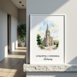 May include: A framed wall art print featuring a watercolor illustration of Linköping Cathedral. The artwork depicts the tall stone church spire against a soft blue and white sky, with green trees at the base. The text reads LINKOPING CATHEDRAL Linkoping.