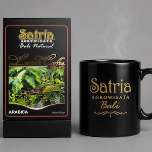 May include: A black coffee mug and a black coffee box with gold lettering. The mug has the words "Satria Agrowisata Bali" printed on it. The box says "Satria Agrowisata Bali Natural Luxury Coffee Arabica".