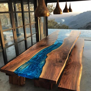 May include: A handcrafted wooden dining table with a blue epoxy resin river running through the center. The table is made of dark brown wood and has a matching bench. The table is approximately 10 feet long.