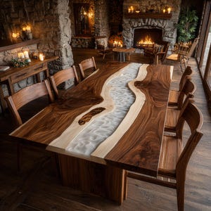 May include: A large, rectangular wooden dining table with a river-like design. The table features a dark brown wood border with a light-colored, wavy, white resin center. Surrounding the table are matching wooden chairs, creating a rustic dining set.