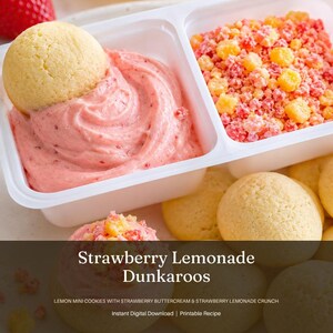 May include: A white plastic container with two compartments, one filled with pink strawberry buttercream and a cookie, the other with strawberry lemonade crunch. The image also shows several yellow mini cookies. Text on the image reads "Strawberry Lemonade Dunkaroos".