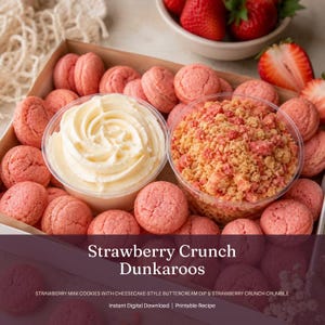 May include: A box of strawberry crunch Dunkaroos, featuring pink mini cookies, a swirl of cheesecake-style buttercream dip, and strawberry crunch crumble. Fresh strawberries are in a bowl in the background. The image includes the text "Strawberry Crunch Dunkaroos".