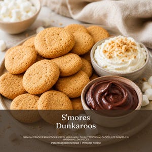 May include: A plate of graham cracker mini cookies, marshmallow buttercream, and chocolate ganache. The image also includes a bowl of marshmallows. The text on the image reads "S'mores Dunkaroos" and "Instant Digital Download | Printable Recipe."