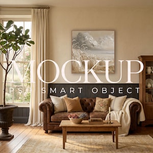 May include: A square wall art mockup featuring a textured landscape painting with wheat fields and clouds. The artwork is displayed above a brown leather tufted sofa with various throw pillows, a wooden coffee table, and a tall potted plant.