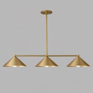 A linear pendant light fitting with a brushed brass finish, featuring a central vertical rod connected to a horizontal bar that supports three downward-facing conical shades, each containing a single small white light bulb.