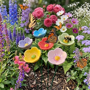 May include: A garden scene with ceramic flower stakes in shades of yellow, pink, blue, and red. Butterflies and bees rest on the flowers, set against a backdrop of blooming flowers and greenery. The scene evokes a sense of natural beauty.