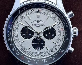 Orologio da uomo vintage Breitling 1884 Navi Timer Chrono al quarzo con quadrante bianco, cassa in acciaio inossidabile, lunetta girevole, secondi e data.