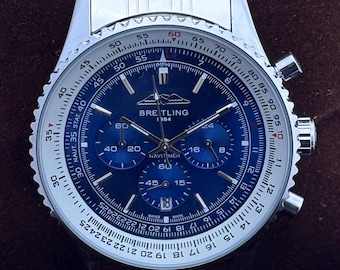 Orologio da uomo vintage Breitling 1884 Navi Timer Chrono al quarzo con quadrante blu, cassa in acciaio inossidabile, lunetta girevole, secondi e data.
