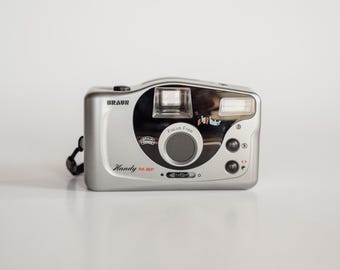 Câmera Braun Handy M-BF | Câmera analógica vintage de 35 mm com foco livre | Câmera retrô "apontar e disparar" | Câmera analógica compacta prateada | Câmera Y2K