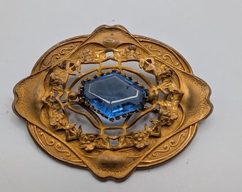 Antieke Victoriaanse grote sjerpbroche met blauwe glassteen, goudkleurig metaal