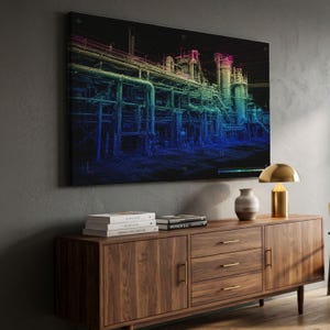 May include: A rectangular wall art piece featuring a digital point cloud rendering of an industrial refinery complex. The structure is depicted in a vibrant gradient of colors, transitioning from deep blue at the base to green, yellow, and pink at the top.
