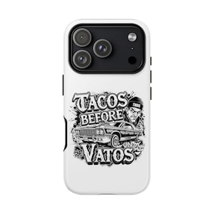 May include: A white smartphone case featuring a black and white graphic illustration of a classic lowrider car, a person wearing a beanie with the word THUG, and the text TACOS BEFORE VATOS in a bold, stylized font with graffiti-inspired accents.