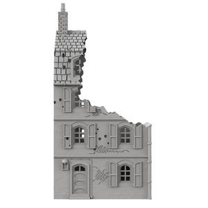 May include: A gray, unpainted miniature model of a damaged three-story building facade. The structure features a tall, narrow design with a chimney, arched windows with shutters, a front door, and jagged, broken edges along the roof and side.