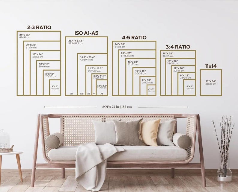 May include: A wall art size guide with various rectangular frames in different ratios, including 2:3, ISO A1-A5, 4:5, 3:4, and 11x14 inches. A sofa, 72 inches or 183 cm wide, is positioned below the guide, with pillows and a blanket.