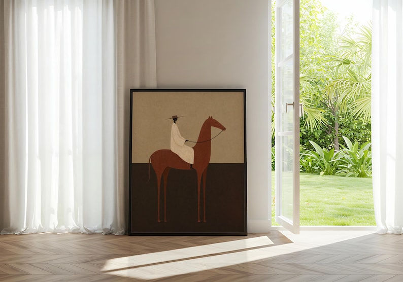 May include: Framed art print featuring a minimalist illustration of a person riding a brown horse. The rider is wearing a white garment and a hat. The artwork has a neutral color palette with a tan background and a dark brown lower section.