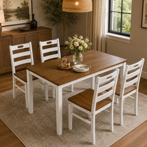 May include: A rectangular dining table with a medium-brown wood top and white legs, accompanied by four chairs featuring white ladder-back frames and matching medium-brown wood seats. A glass vase with white flowers sits on the table surface.