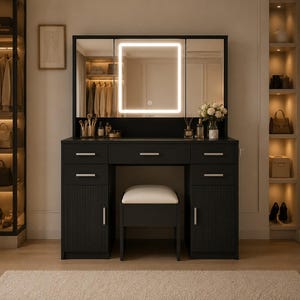 May include: A black vanity table featuring a tri-fold mirror with a square LED light, five storage drawers, and two lower cabinets with vertical ribbed doors. A matching stool with a white cushioned seat is tucked underneath the center section.