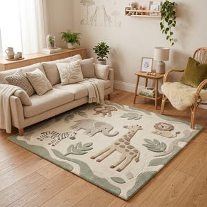 May include: A rectangular area rug with a safari animal theme. The rug features a cream-colored background with a green border and includes a zebra, elephant, giraffe, lion, and monkey. The rug is placed in a living room setting.