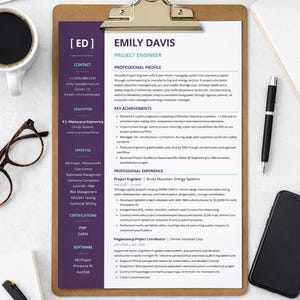 May include: A resume for Emily Davis, a Project Engineer, displayed on a brown clipboard. The document features a dark purple sidebar with contact details, education, and expertise, alongside a white main section detailing professional experience.