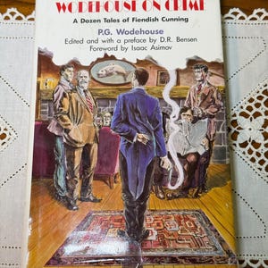 May include: A paperback book titled Wodehouse on Crime: A Dozen Tales of Fiendish Cunning by P.G. Wodehouse, edited by D.R. Bensen with a foreword by Isaac Asimov. The cover features an illustration of five men in a room with a fireplace.