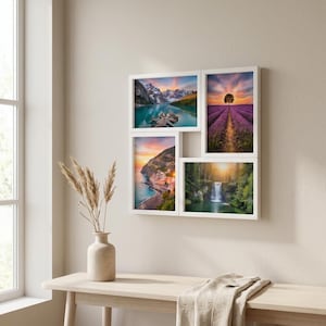 May include: A white multi-photo frame with four landscape images. The images depict a mountain lake, a lavender field, a coastal town, and a waterfall. The frame is mounted on a beige wall above a wooden table with a vase and dried plants.