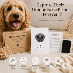 May include: A dog with a kit to capture its nose print. The kit includes a box, instructions, and a print card. The text on the box reads "Nose Print Kit" and "Capture Your Pet's Unique Nose Print Forever". The dog is light brown.