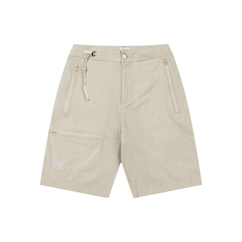 May include: Beige shorts with multiple pockets and a zip closure. The shorts have a relaxed fit and a drawstring waist. The shorts have a small logo on the left pocket. The shorts are made of a lightweight material.