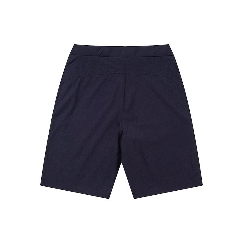 May include: Navy blue shorts with a tailored design. The shorts have a flat front and a clean, minimalist aesthetic. The fabric appears to be a lightweight, woven material, suitable for warm weather. The shorts are designed for comfort and style.
