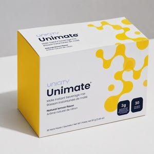 May include: A rectangular box of Unicity Unimate mate instant beverage mix in natural lemon flavor. The white packaging features yellow abstract circular patterns, dark blue text, and two black squares indicating 3g and 30 packets.