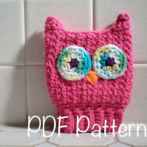 May include: Pink crocheted owl hat with colourful eyes. PDF Pattern.