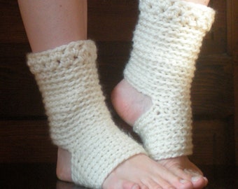 May include: A pair of white crocheted ankle warmers with an open heel design. The warmers are made with a simple stitch pattern and are a great way to keep your feet warm in the winter.