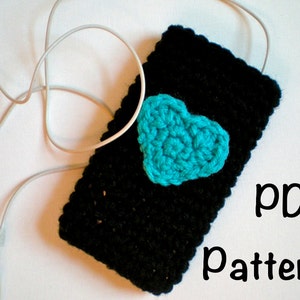 May include: A black crocheted phone case with a turquoise heart on the front. The text "PDF Pattern" is written below the case.