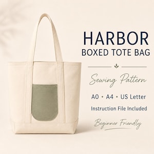 May include: A cream-colored canvas tote bag with two long shoulder straps and a sage green rounded exterior pocket. Text reads: HARBOR BOXED TOTE BAG, Sewing Pattern, A0, A4, US Letter, Instruction File Included, and Beginner Friendly.