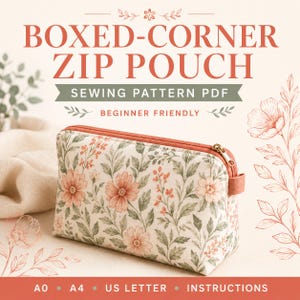 May include: A rectangular zip pouch featuring a floral pattern with muted orange flowers and green leaves on a cream background. The pouch has a matching orange zip and a small side tab. Text reads: BOXED-CORNER ZIP POUCH SEWING PATTERN PDF.