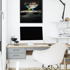 May include: A framed vertical wall art print featuring a dark space scene with two figures sitting on a cratered lunar surface, looking out at a glowing, partially illuminated Earth suspended in the black void of the deep night sky.