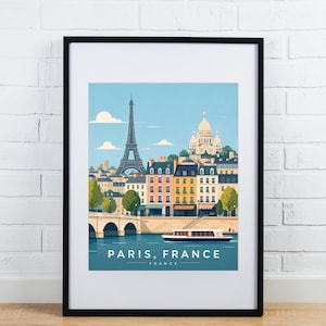 Könnte beinhalten: Gerahmter Kunstdruck mit einer stilisierten Illustration von Paris, Frankreich. Das Kunstwerk zeigt den Eiffelturm, die Basilika Sacré-Cœur und farbenfrohe Gebäude an einem Fluss. Der Druck ist in einem schwarzen Rahmen.