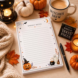 May include: A white notepad with horizontal lines and the text SPOOKY NOTES at the top. The border features illustrations of a spider web, a bat, a crescent moon, stars, a jack-o'-lantern wearing a witch hat, a ghost, and a black cauldron.