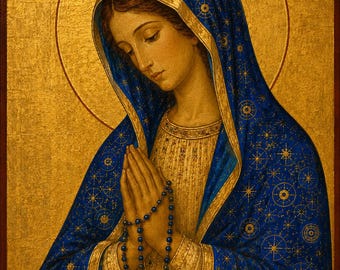 May include: A religious icon painting featuring a figure with a gold halo, wearing a blue head covering adorned with gold star patterns. The figure has hands clasped in prayer holding a blue beaded rosary with a cross. Text MP and ΘV appear above.