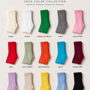 May include: A collection of fifteen ribbed socks in various colors including ivory, white, emerald green, grey, light pink, red, sage green, red orange, blue, burgundy, lilac, light beige, moon yellow, baby blue, and black, labeled VOWTHREAD.